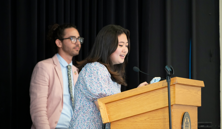 Students speak at a podium at Pitt Sustainability Awards Luncheon in April 2023.