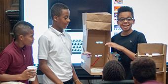 students presenting project during program at city school