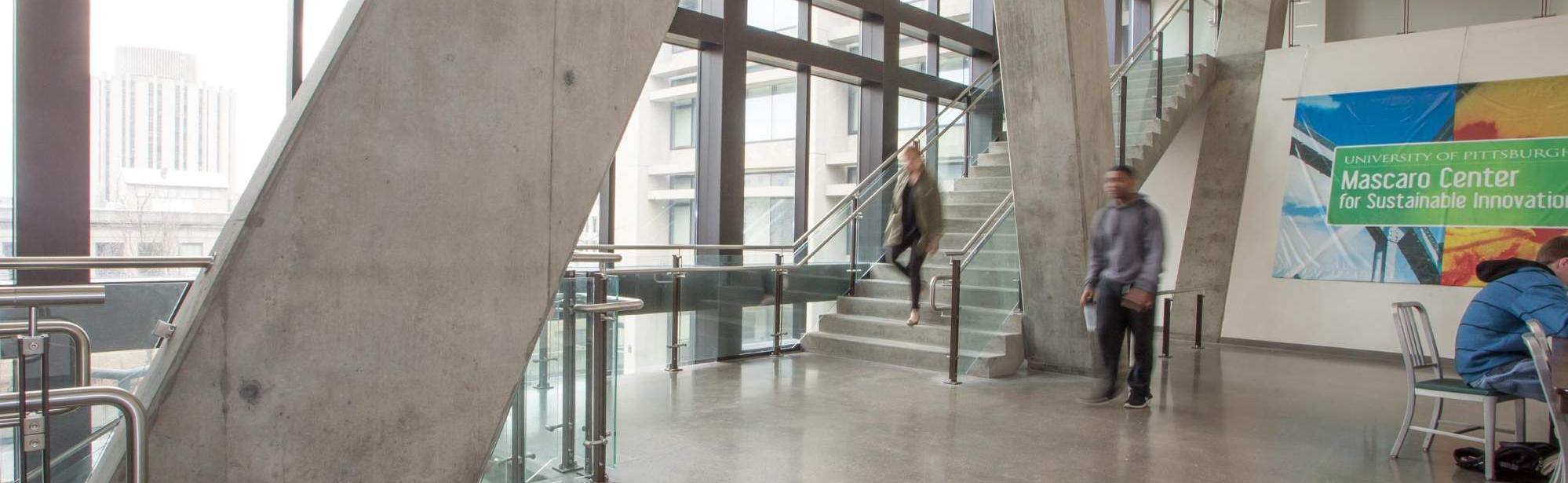 Students walking in public area outside of Mascaro Center for Sustainable Innovation